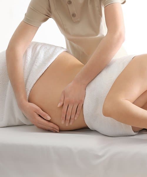 Lady giving massage for pregnancy to a lady