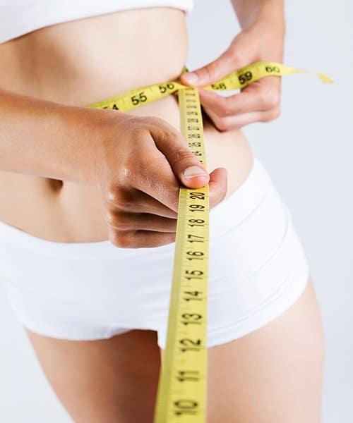 Girl Measuring waist after Slimming massage