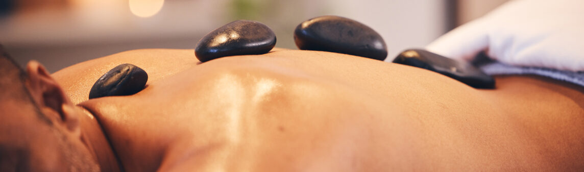 Hot Stone Massage for relaxation and warmth at Yinyang Connection Spa in Dubai and Abu Dhabi.