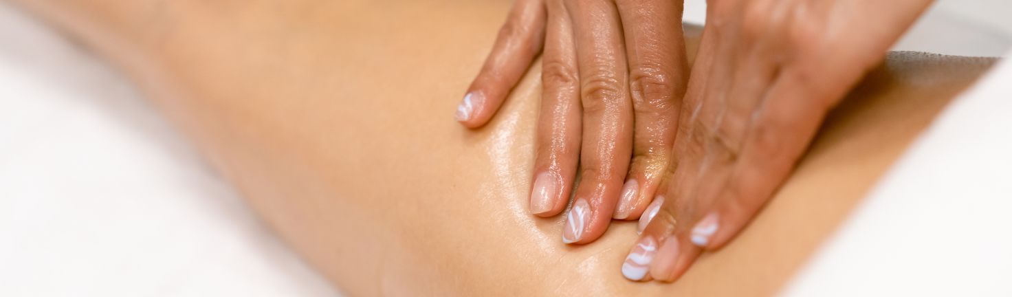 Therapist performing a sports massage to improve mobility and prevent injuries at Yinyang Spa Dubai.